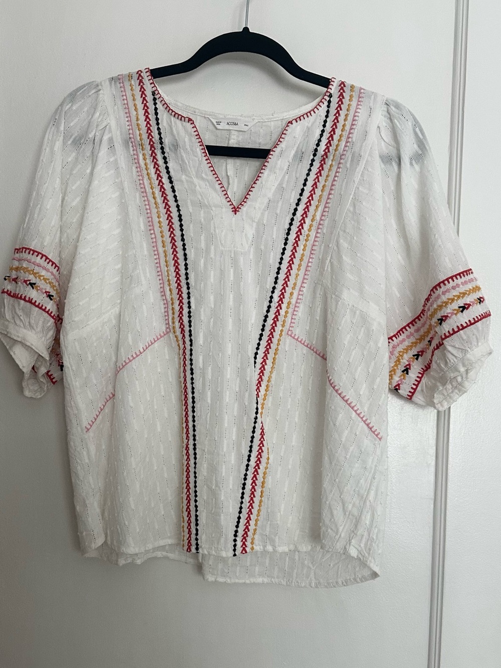 White top with colorful embroidery